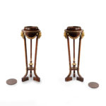 A pair of mahogany and gilt metal jardinières/torchères