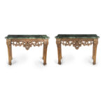 A pair of late Victorian marble and giltwood console tables in the manner of William Kent and Benjamin Goodison