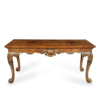 A finely carved walnut side table in the George II style by the Harry Meyers Company of New York and Chicago