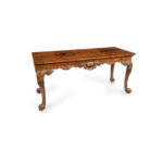 A finely carved walnut side table in the George II style by the Harry Meyers Company