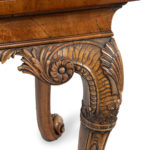 A finely carved walnut side table in the George II style by the Harry Meyers Company corner