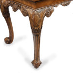 A finely carved walnut side table in the George II style by the Harry Meyers Company corner