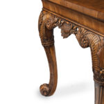 A finely carved walnut side table in the George II style by the Harry Meyers Company corner