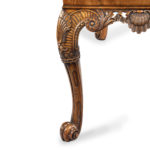 A finely carved walnut side table in the George II style by the Harry Meyers Company side leg